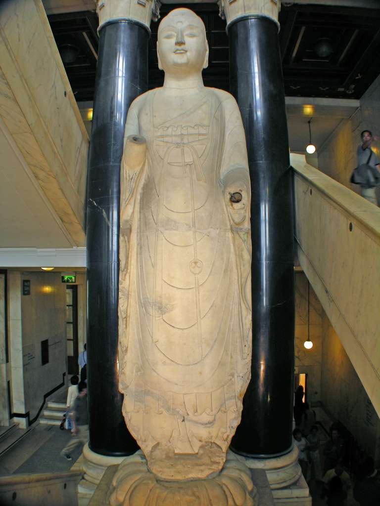 British Museum Top 20 09 Marble Buddha Amitabha 9. Amitabha - North China, 585AD, 5.8m high. This marble statue of the Meditation Buddha of the west has a very solid form and drapery in extremely flat folds.